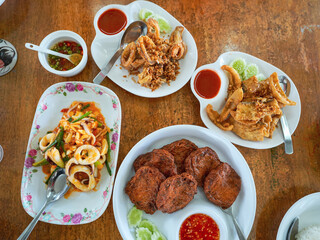 Crispy fried river fish in Thailand. Fried fish refers to any fish or shellfish that has been prepared by frying. Often, the fish is covered in batter, or flour, or herbs and spices before being fried