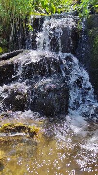 A mountain stream in the mountains of the Sairam-Ugam National Park in the Republic of Kazakhstan, Shymkent, Kaskasu gorge. At an altitude of 2000 meters above sea level.