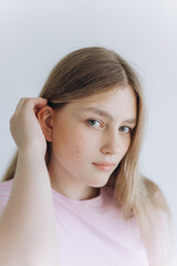 Pretty young blondie tender teenage caucasian girl. Close up portrait of a young woman