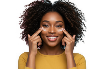 Smiling black woman applying eye cream with fingers