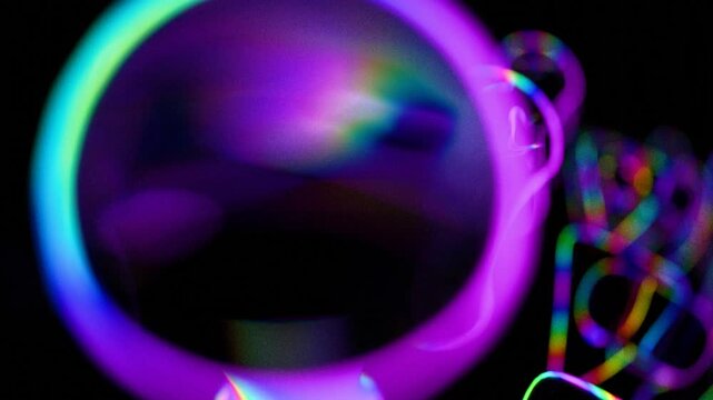 a close up of a colorful object in the dark