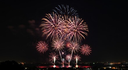 Spectacular Fireworks Display Over City Skyline at Night