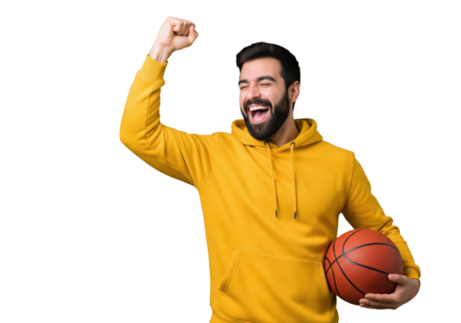 Excited man celebrating victory with a basketball isolated on a transparent background

