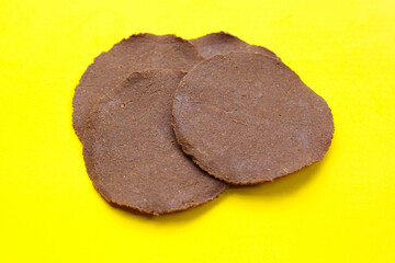 Sun-dried fermented soybean sheets called “Thua Nao,” a traditional ingredient in Northern Thai cooking.