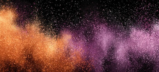 Abstract explosion of orange and purple powder on black background