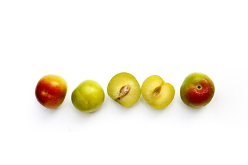 Fresh green plum fruit on white background.