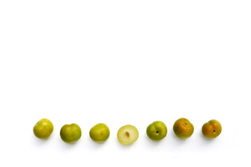 Fresh green plum fruit on white background.