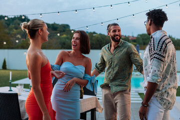 Friends laughing and having fun at a pool party