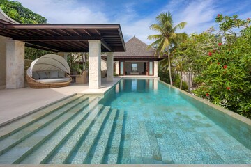 Luxurious Poolside Oasis With Palm Trees, Cabana Seating, And Ocean View Resort Setting