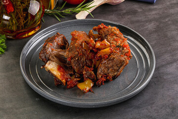 Baked beef ribs with vegetables