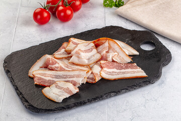 Raw pork tenferloin with bacon