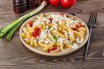 Italian pasta fusili with curd
