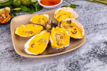 Baked oyster with cheddar cheese