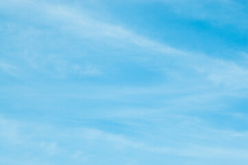 blue background, photo shows blue sky and white clouds