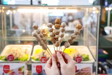 Grilled Meatballs on Sticks at a Food Stall.