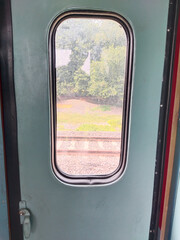Fototapeta premium Closed door of high speed indian train and lock panel