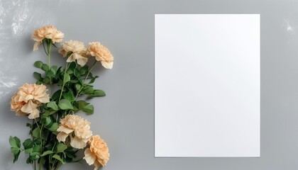 Top view of blank a4 paper with peach flowers on gray background with copy space
