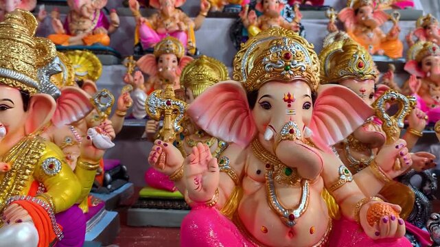 Newly made idols of the God known as Ganesha or Ganapati for sale at a shop on the eve of Ganesh festival in Pune, India.