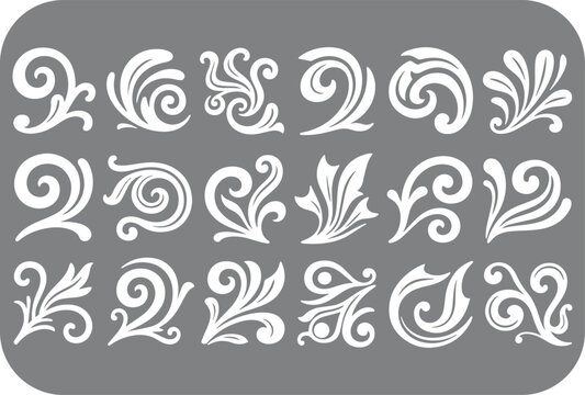 A collection of elegant white swirls and flourishes on a gray background perfect for decorative design elements