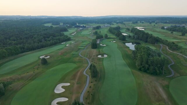 Push in drone shot of TPC Toronto at Osprey Valley Golf Course at sunset in Alton, Caledon, Ontario, Canada