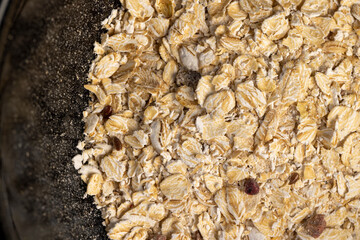 oatmeal porridge with fruits , filled with instant oatmeal porridge with additives, closeup