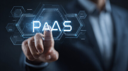 Obraz premium Digital technology solution. Platform as a Service shown on a digital screen being touched by a person in a business suit.