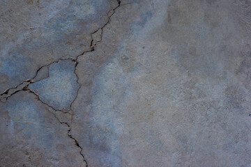 Close-up of cracked and rough concrete for overlay background.