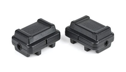 Isolated pair of sleek dark receptacles offer a minimalistic aesthetic design element for