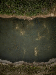 Drone aerial view of Southern Water polluted lakes after a sewage treatment plant discharge into the river