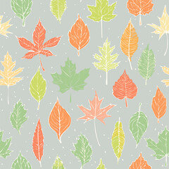 Obraz premium Seamless fall pattern with colorful hand-drawn leaves in orange, red, yellow, and green on a light background. Perfect for autumn-themed designs