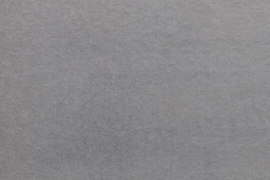 Gray background of smooth glossy paper close-up old for wallpaper