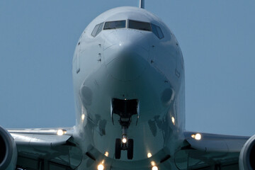Close-Up of Passenger Jet Nose and Cockpit Windows. Airplane in the blue sky, close-up of the plane