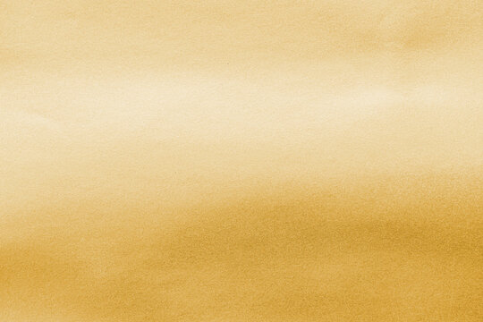 Gold background foil golden leaf metallic texture gradient light shiny reflective wrapping paper bright yellow solid color wallpaper for design decoration element backdrop