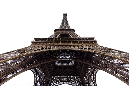 View of the Eiffel Tower's wrought-iron latticework rises boldly against the stark white sky, its intricate design a testament to architectural ingenuity, Paris, &Atilde;Žle-de-France, France.