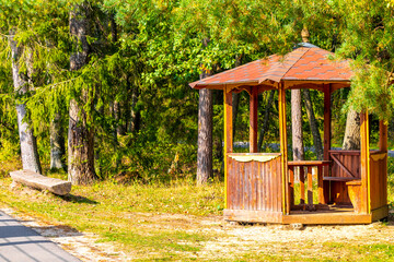 Wooden hut pergola for relaxing in the forest in Belarus.