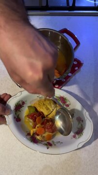Serving chicken soup with delicious sauce side dish of vegetable homemade Persian food festive family dinner gathering gourmet cheerful kitchen tradition holiday sharing table in ceremony family party