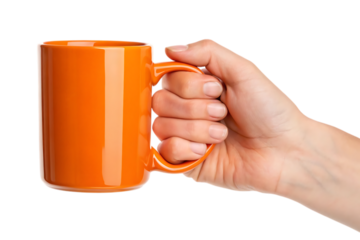 Orange mug held in hand on transparent background