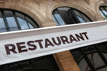 Obraz premium Stone facade of a French restaurant in Bordeaux city