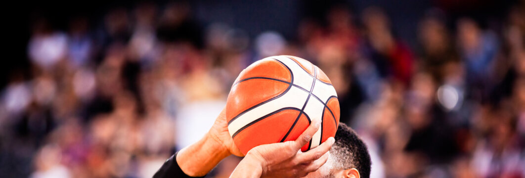 basketball player shooting three pointer