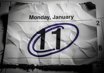 January 11th calendar date circled on crumpled paper page