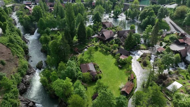 Watermill village Rastoke on rivers Slunj and Korana. Charming village of Rastoke with waterfalls, wooden houses, rivers running through. Aerial view of fairy-tale spring location in heart of Croatia