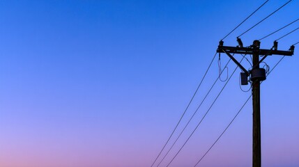 Silhouette of power lines against twilight sky