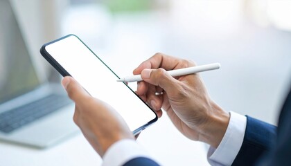 A professional businessman is signing a digital contract with a stylus on a mobile phone. This electronic signature provides legal approval for a corporate document.