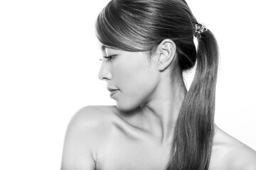 Naklejka premium Beautiful asian woman with long dark and healthy hair and clear skin