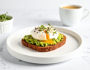 Delicious and healthy avocado toast with a perfectly poached egg, runny yolk, and fresh microgreens, served for a gourmet breakfast.