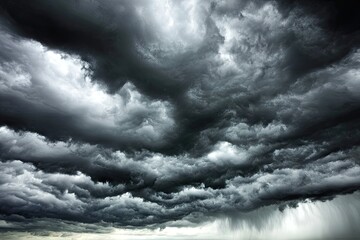 Dark, ominous clouds fill the sky, rain falling