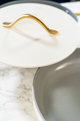 Top View of Pot with White Lid and Gold Handle