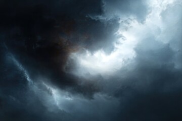 Obraz premium Dramatic storm clouds with a glimpse of light
