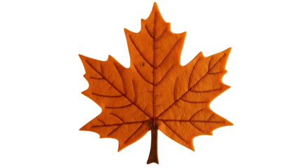 Orange felt maple leaf casts soft shadow on black. Ideal for autumn designs, seasonal graphics, product photography.