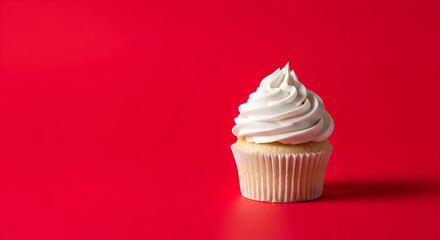 Delicious Vanilla Cupcake with Cream Cheese Frosting on Red Background